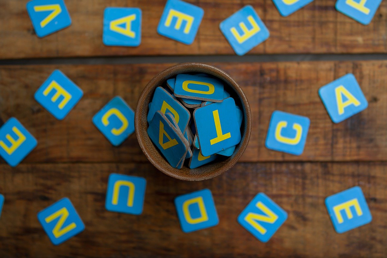 An image of a scrabble tiles on a table.